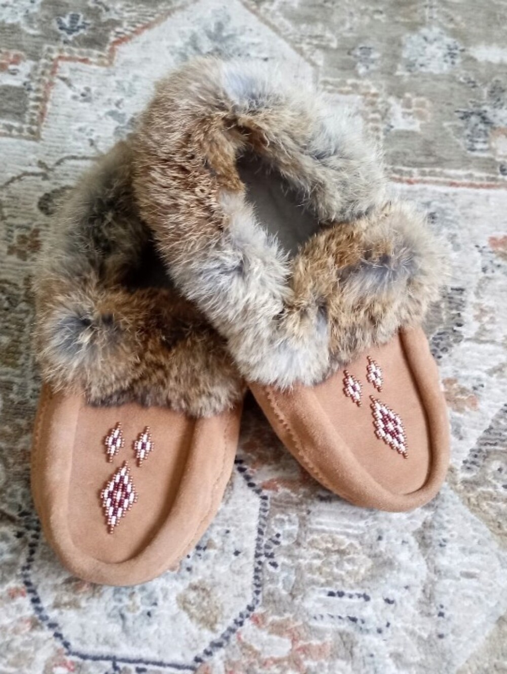Manitobah Mukluks suede leather moccasin slippers with a fur trim